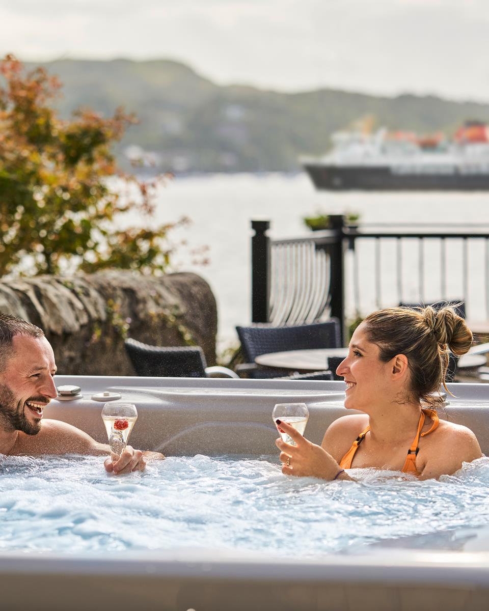 Couple in Outdoor Hot Tub at Oban Bay Hotel