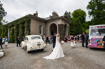 Couple & Wedding Car Outside Thainstone House