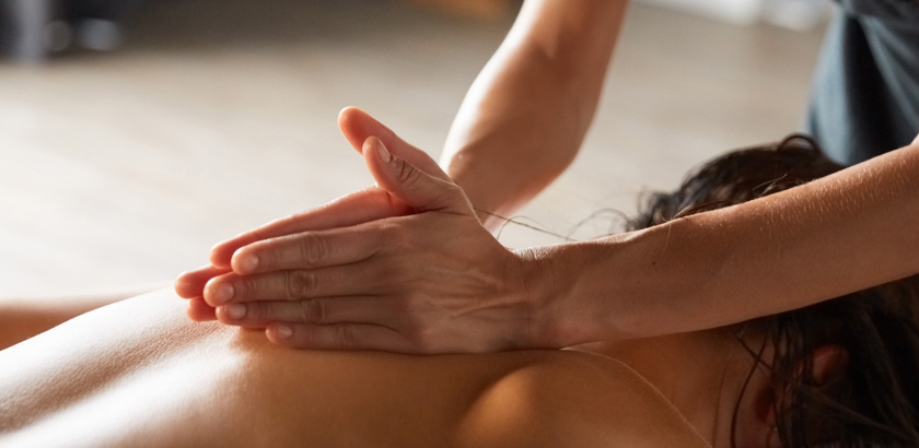 Fonab Castle | Two hands massaging woman's back during a spa break in Pitlochry, Scotland ?? Fonab Castle