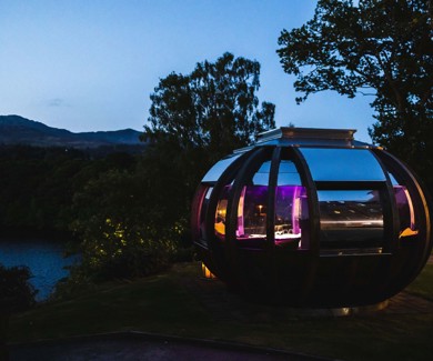 Fonab Castle | Dining pod at dusk with Scottish loch and mountains backdrop in Pitlochry  ?? Fonab Castle