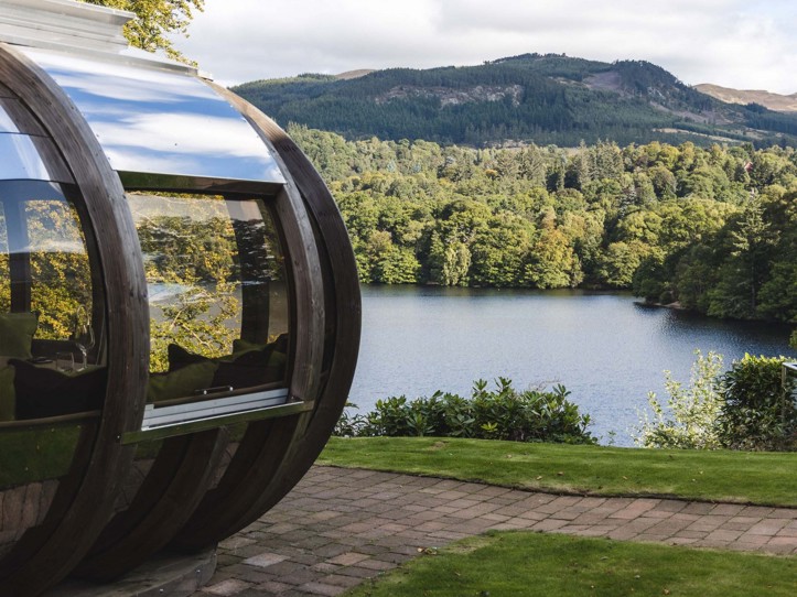 Fonab Castle | View of loch and pine trees from a dining pod at Fonab Castle Luxury Hotel Scotland  ?? Fonab Castle